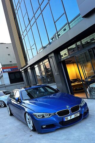 Sleek Blue BMW in Urban Setting 🚗✨
