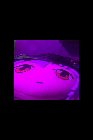 Plush Character Under Purple Light