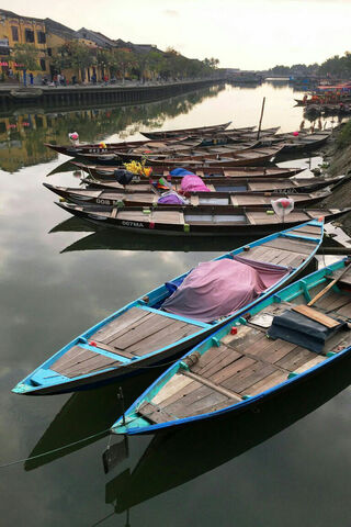 Tranquil Waters: A Glimpse of Riverside Life 🌊🚣‍♂️