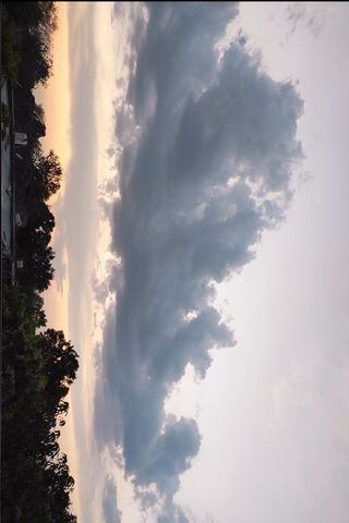 Serene Sunset Skies 🌅☁️
