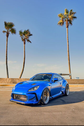 Stunning Blue Sports Car by the Beach 🌊🏎️
