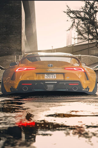 Sleek Yellow Toyota Supra in Urban Setting 🚗✨