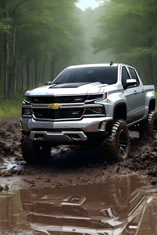 A Truck Driving Through A Muddy Road
