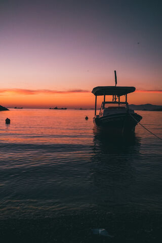 Serene Sunset at the Shore 🌅🚤