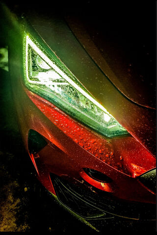 Shimmering Elegance: The Alluring Headlight of a Sporty Car 🚗✨