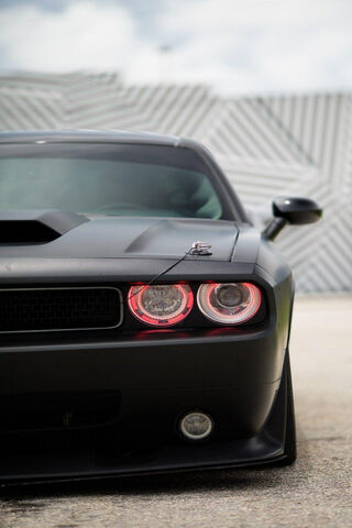 Sleek Black Muscle Car ..