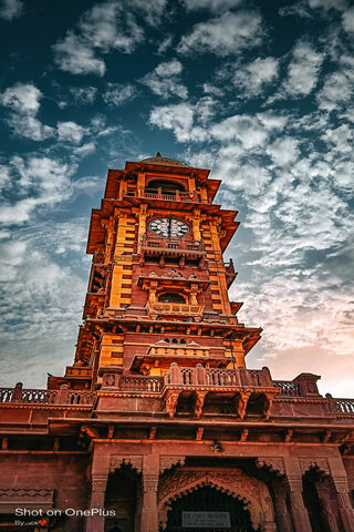 Majestic Clock Tower Under a Dramatic Sky 🕰️🌥️