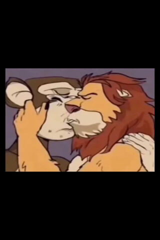 Unexpected Friendship: A Wild Embrace 🦁🐒