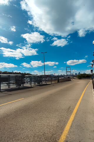 Serene Cityscape Under a Blue Sky 🌤️