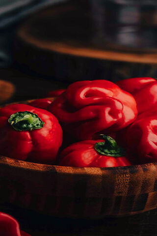 Vibrant Red Peppers in a Rustic Bowl 🌶️🍽️