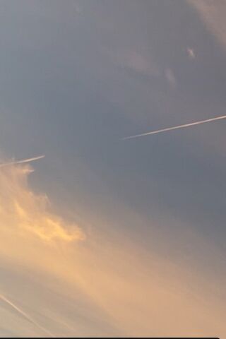 Serene Sky Trails 🌤️✈️