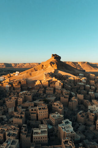 Majestic Mountain Overlooking Ancient Architecture 🏜️🏛️
