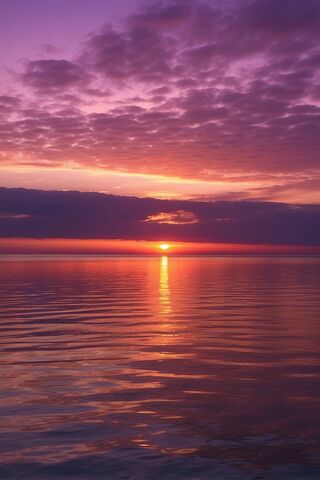 Serene Sunset Over Calm Waters 🌅