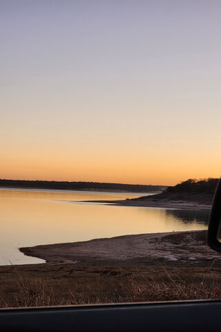 Serene Sunset by the Wa..