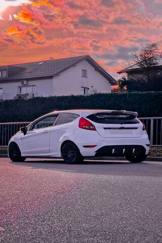 Sleek White Ride at Sun..