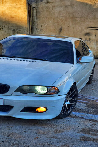 Sleek White BMW on Disp..