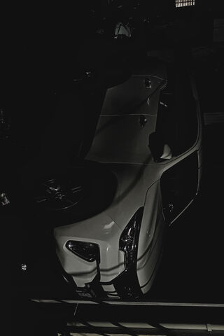 Sleek Shadows: A Car in the Dark 🚗🌌
