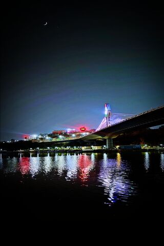 Night Reflections of a City Bridge