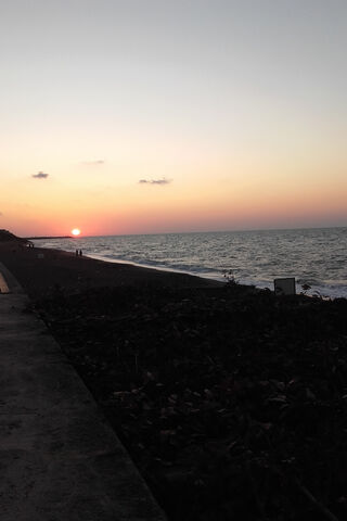 Serene Sunset by the Sh..
