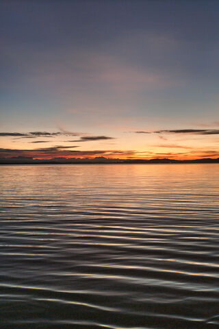 Serene Sunset Over Calm..