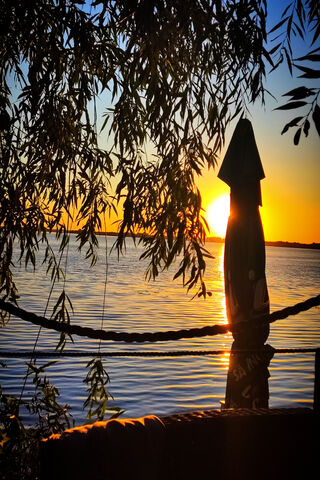 Serene Sunset by the Water 🌅