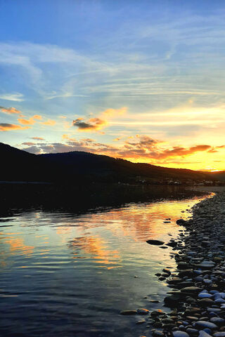 Serene Sunset by the River