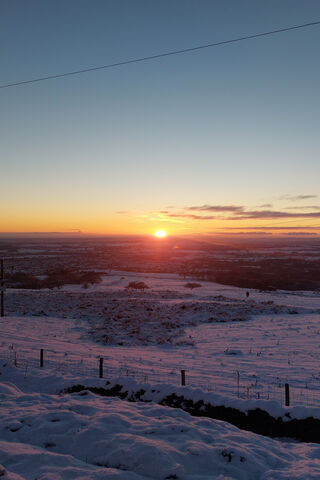 Winter Sunset Over Snow..
