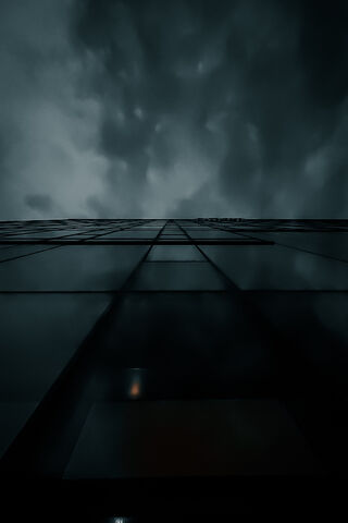 Gazing Upward: A Towering Reflection 🌆☁️