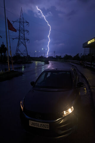 Stormy Drive: Nature's Light Show 🌩️🚗