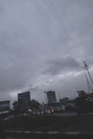 Gloomy Cityscape at Dusk 🌆🌧️