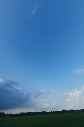 Serene Sky Over Green F..