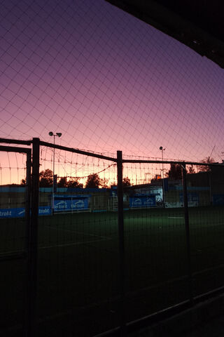 Sunset Over the Pitch: ..