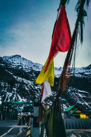 Winds of Tradition: Colorful Flags in the Mountains 🌄🎏