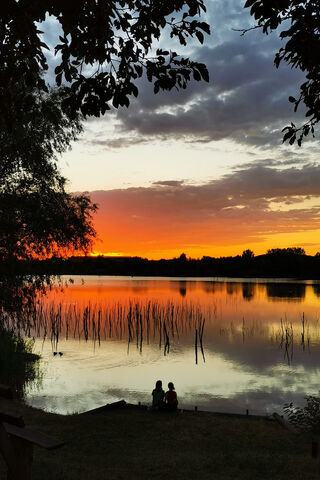 Serene Sunset by the La..