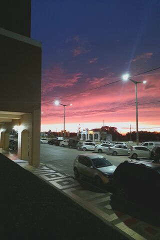 Stunning Sunset Over the Parking Lot 🌅