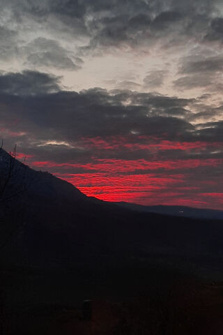 Fiery Sunset Over the M..