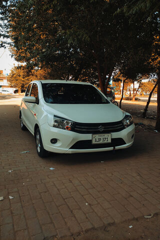 Sleek White Suzuki on a Sunny Day ☀️🚗