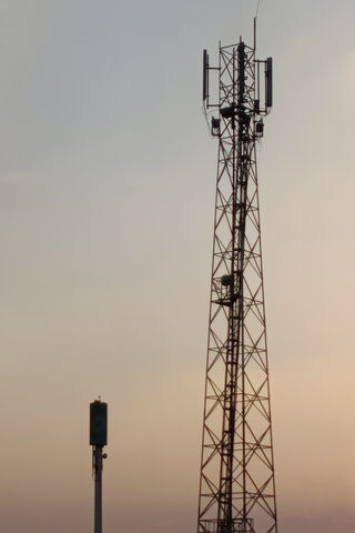 Reaching for the Sky: Communication Towers at Dusk 🌅