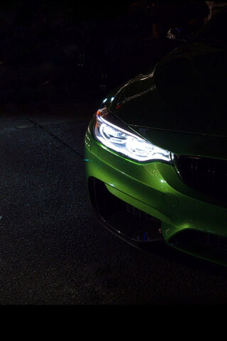 The Bold Green BMW M4: A Nighttime Stunner! 🌟🚗