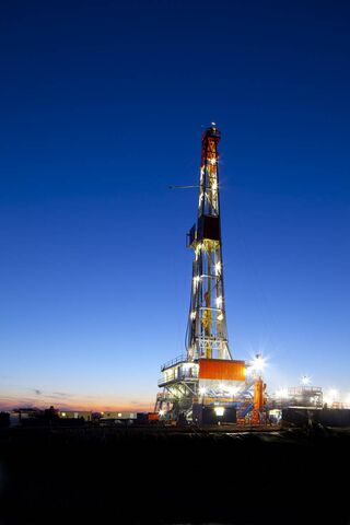 Giant of the Deep: The Oil Rig at Dusk 🌅