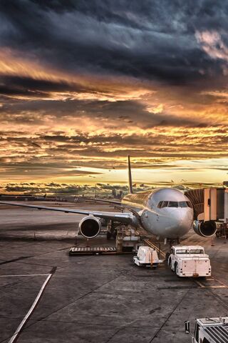 Golden Horizons: A Sunset Over the Runway 🌅✈️