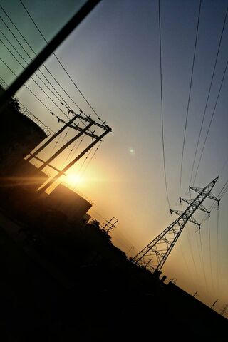 Sunset Serenity: The Dance of Electric Poles