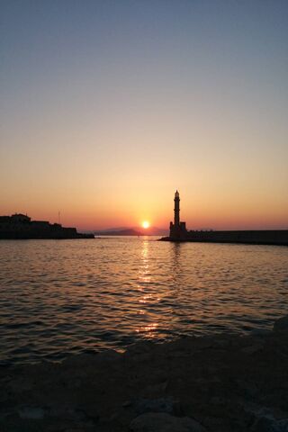 Sunset Serenity at Chania's Lighthouse 🌅