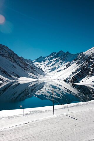 Majestic Reflections: The Serenity of Snow-Capped Peaks 🏔️✨